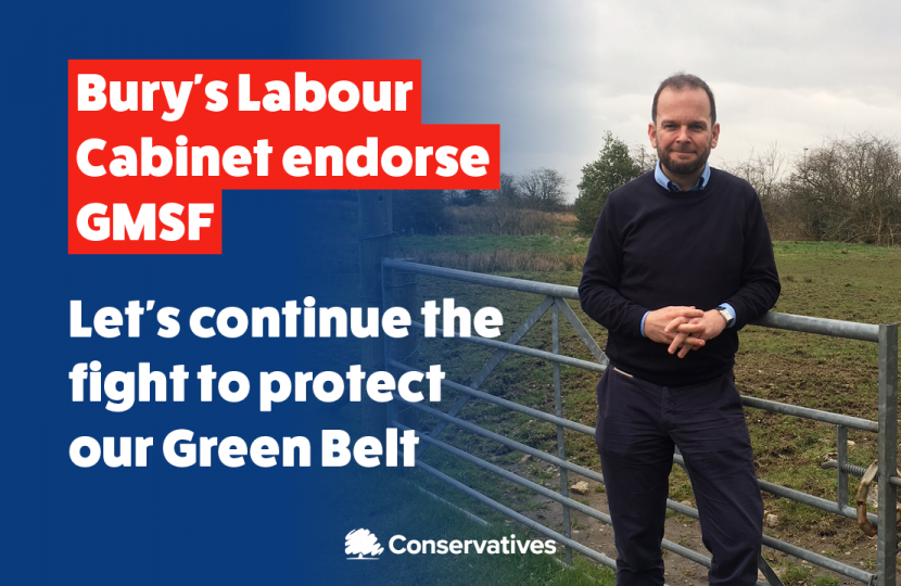 James Daly stands in a field, leaning on a gate. The left of the image fades to a dark blue. Overlaid, in a red box in white writing it says "Bury Labour Cabinet endorses GMSF". Below this in white writing it says "Let's continue the fight to protect our Green Belt"