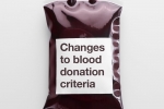 A blood bag with "Changes to blood dontation criteria" written on it